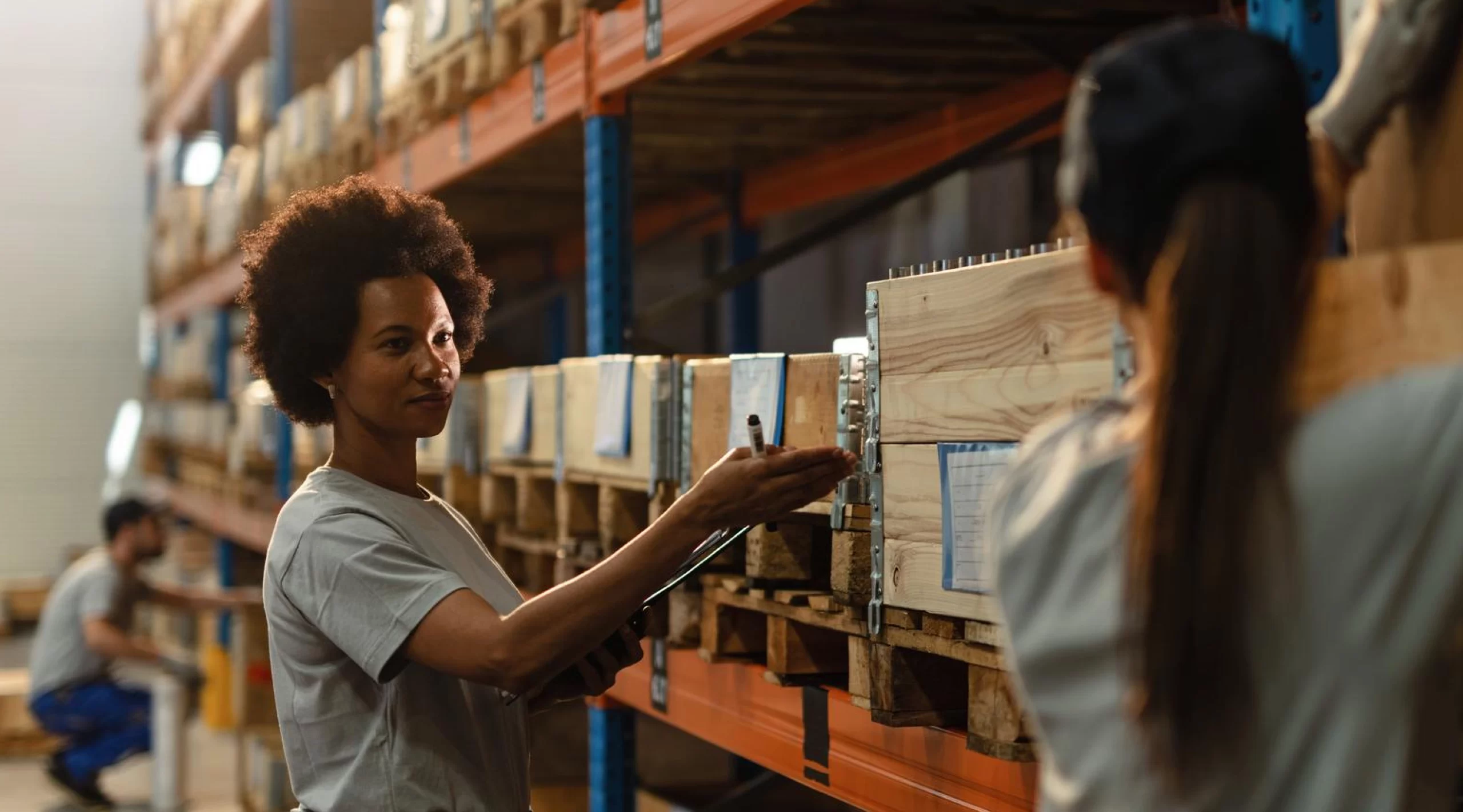 Two women working in a retail warehouse.